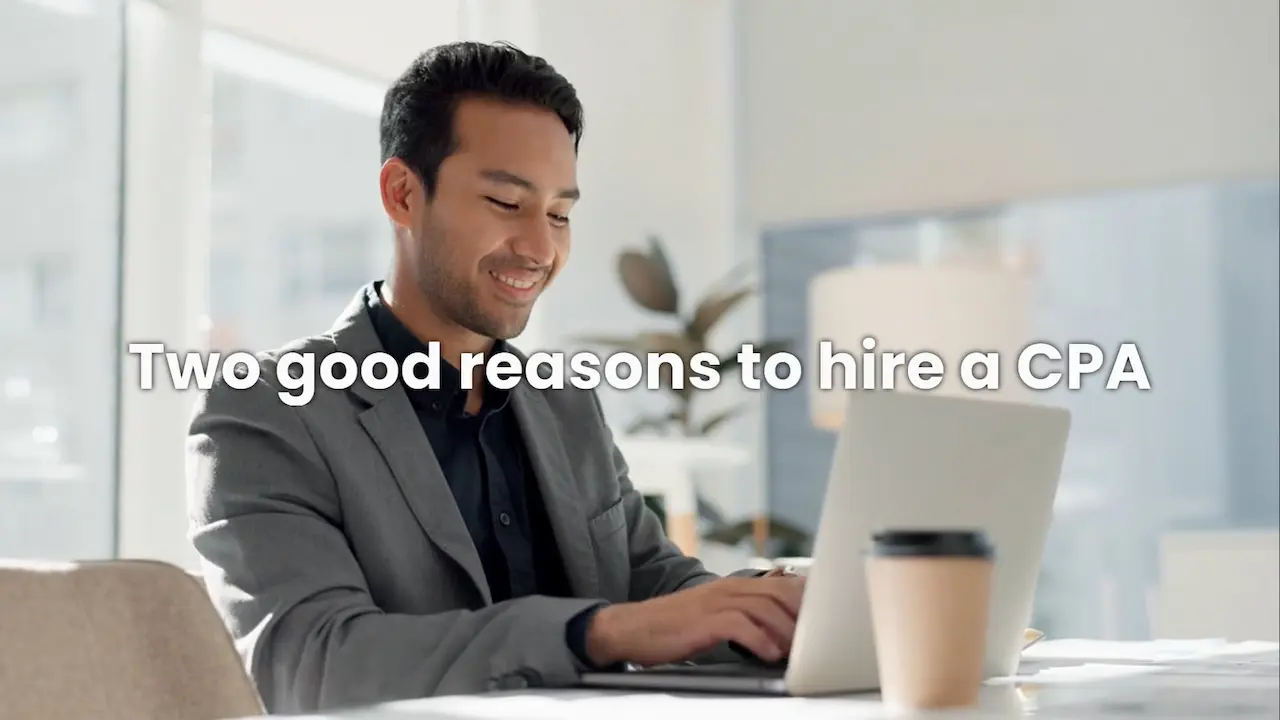 Young man in casual business clothes, working at a laptop